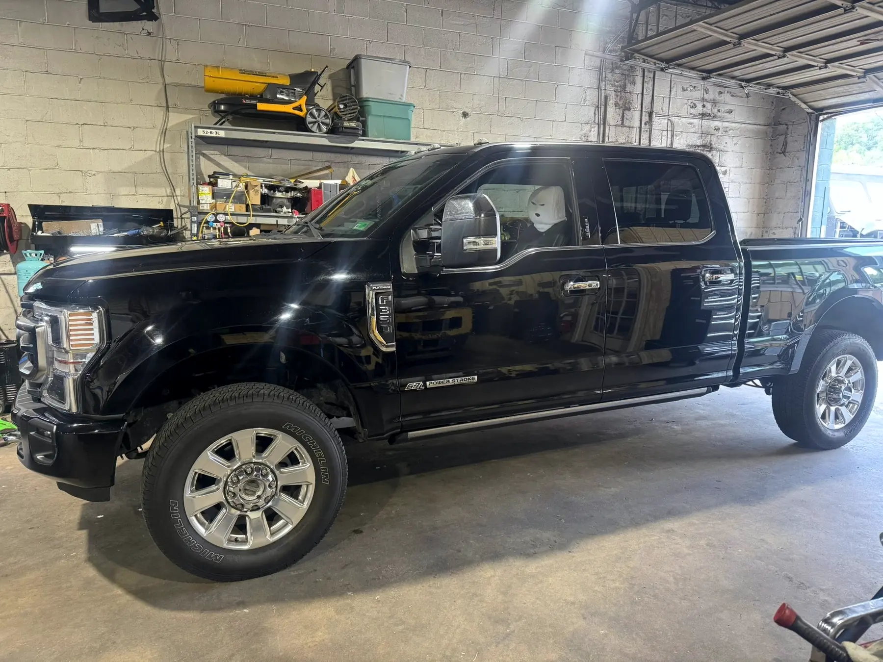 Black Ford Super Duty Platinum in the CBS Diesel shop
