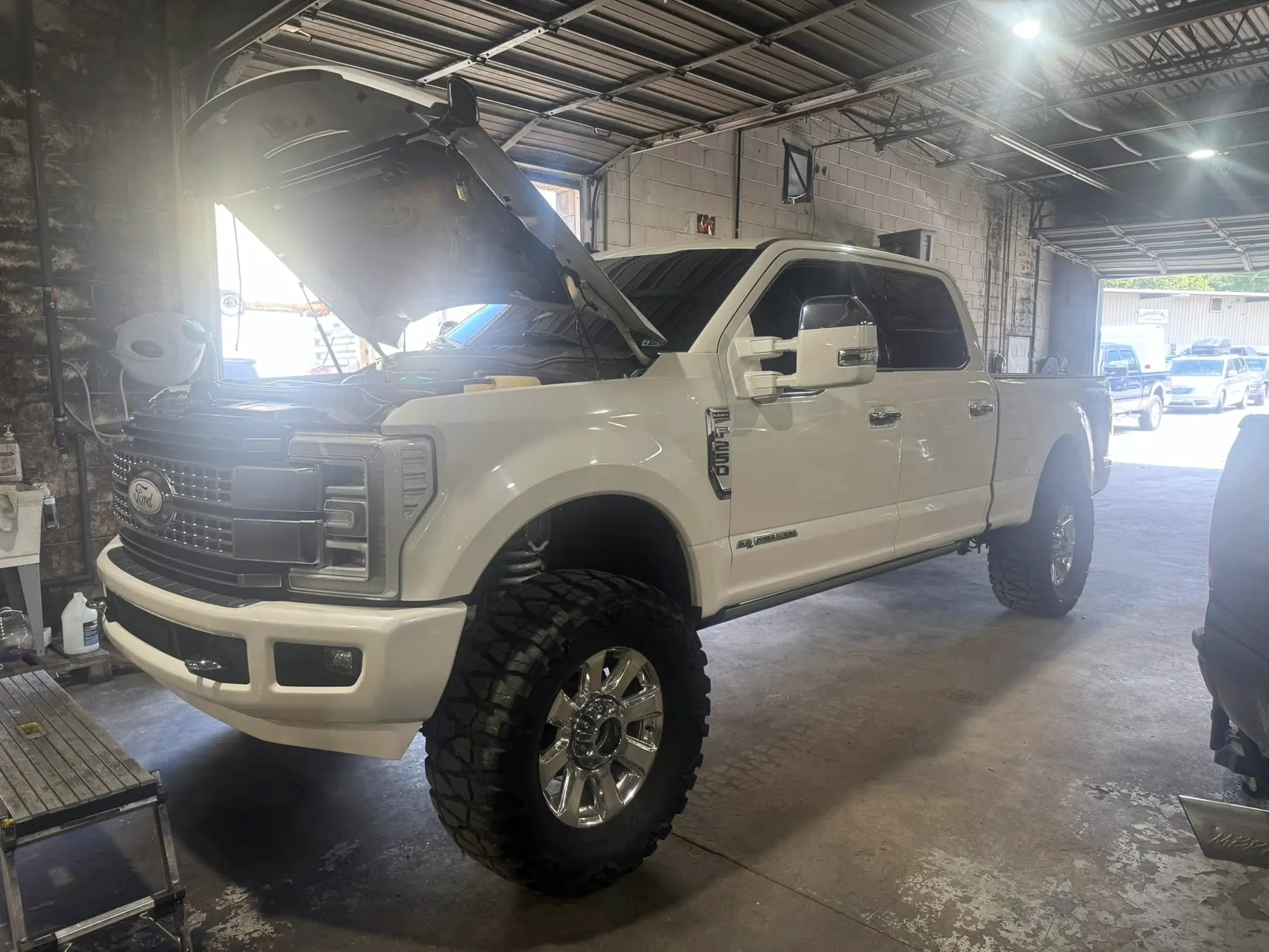 White Ford F-250 Platinum on aftermarket wheels, finished and ready for collection