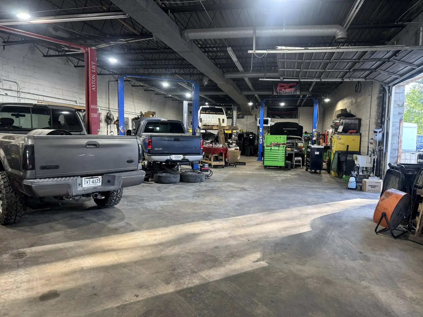 Interior of the CBS Diesel workshop showing the two-post lifts and equipment